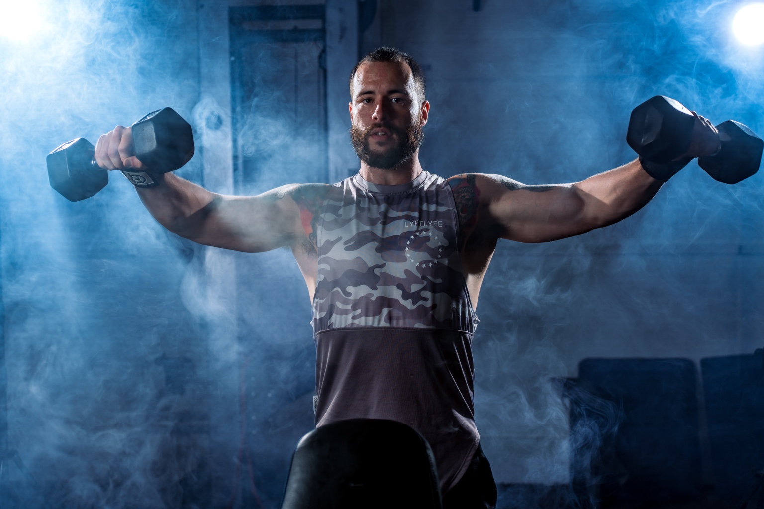 Matt performing dumbbell raises