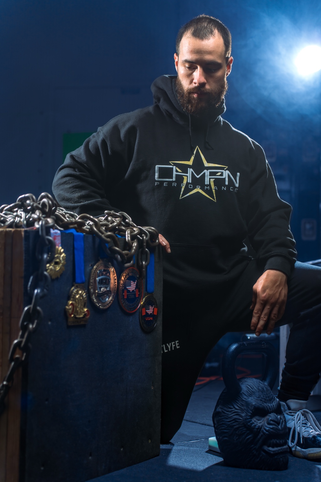 Matt in his Champion Performance hoodie with competition medals