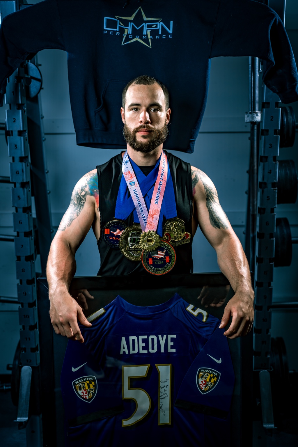 Matt with his competition medals and jersey